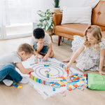 Children playing on the floor with spiral domino map